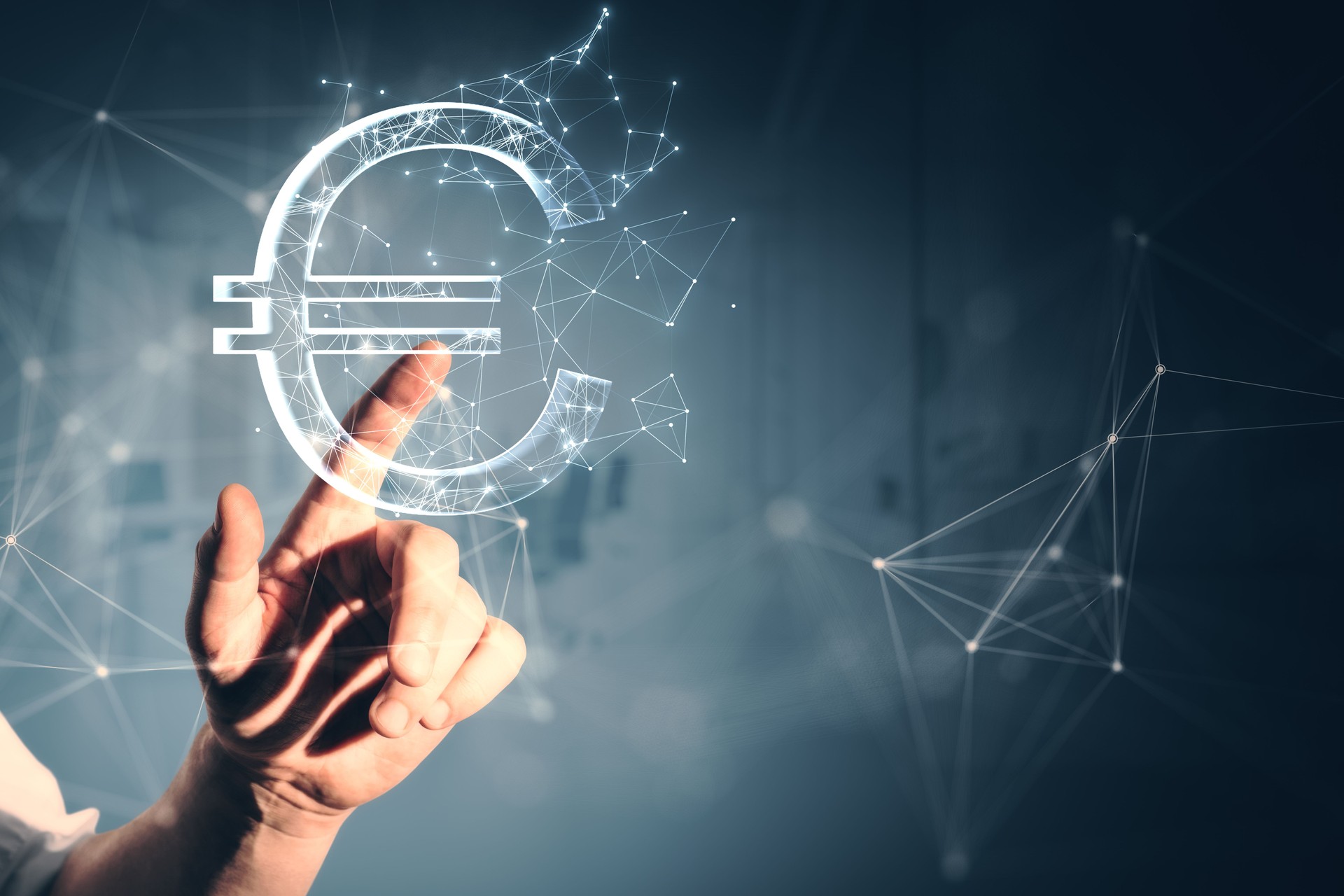 Close up of male hand pointing at creative polygonal euro sign on gray wall background. Online banking, money and trade concept.